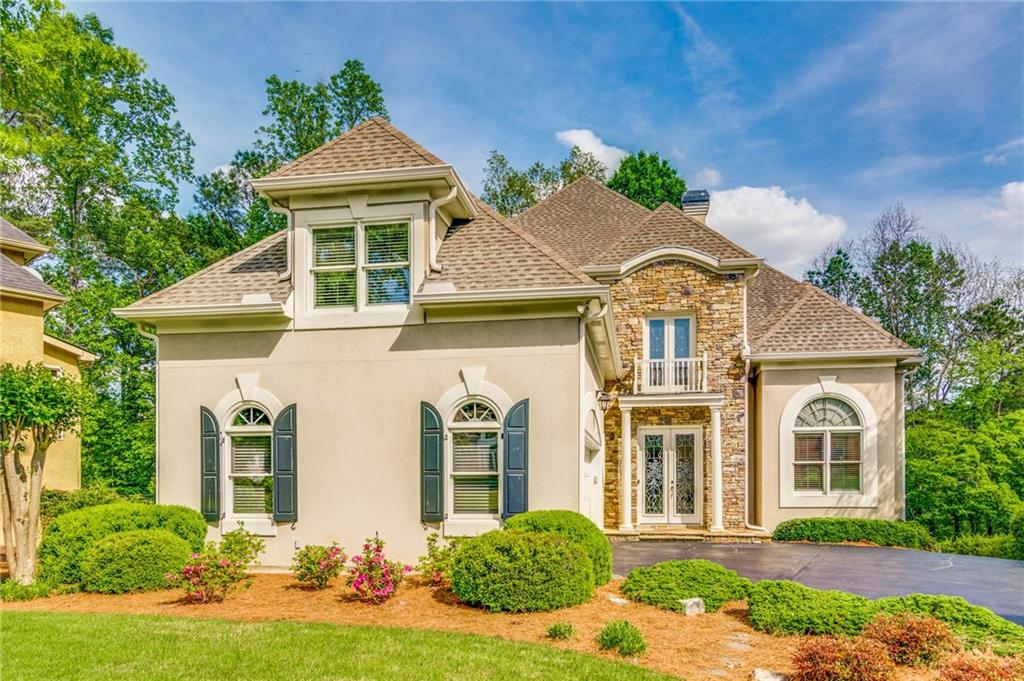 230 Stoney Ridge Drive Alpharetta, GA 30022 - Photo 1 of 1 front view of a house with a yard