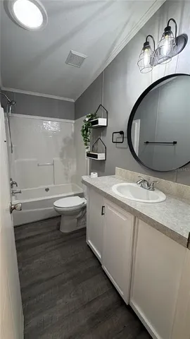 a bathroom with a double vanity sink and mirror