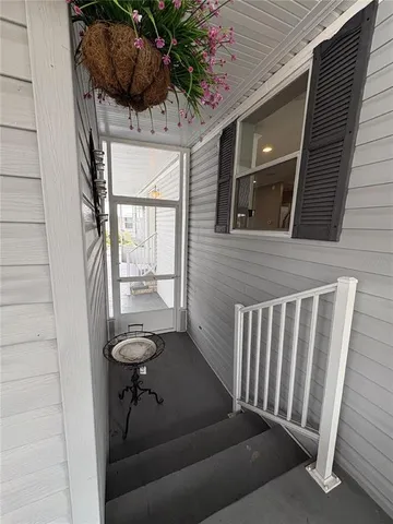 a view of balcony with a potted plant