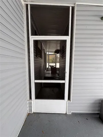 a view of an empty room and fire place
