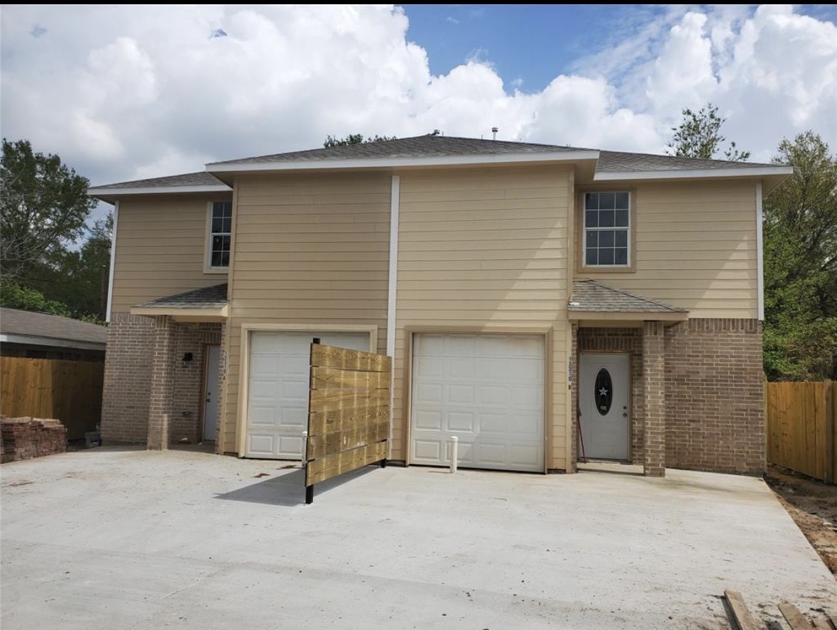 a front view of a house with yard