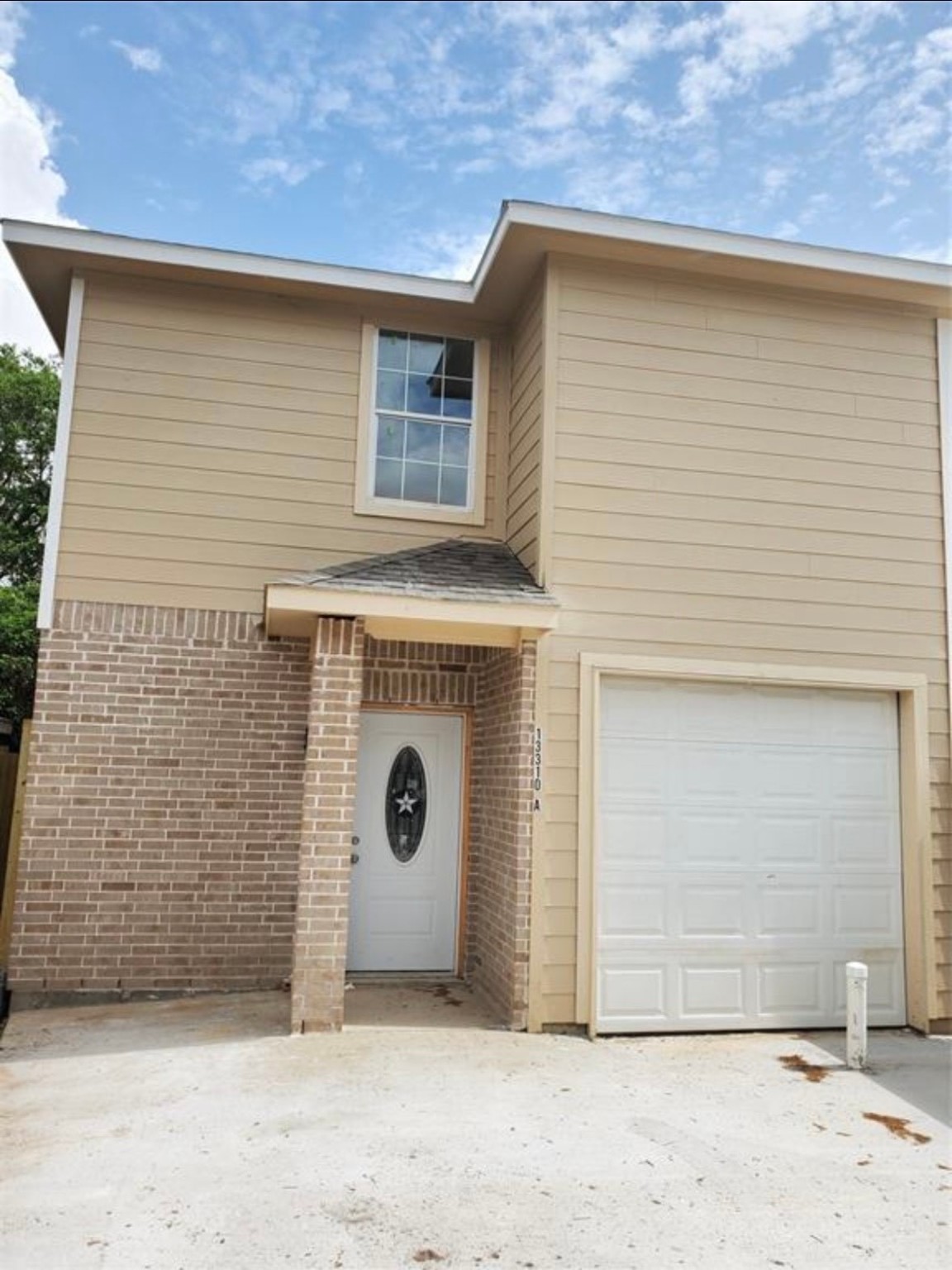 13310 Robertcrest Street, Unit B Houston, TX 77039 - Photo 3 of 6 a view of a house with a garage