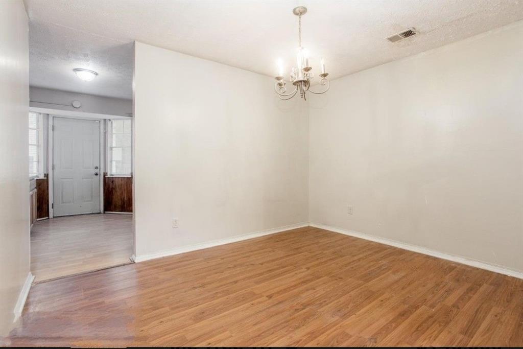 602 Pine Tree Trail Atlanta, GA 30349 - Photo 3 of 7 wooden floor in an empty room with a window