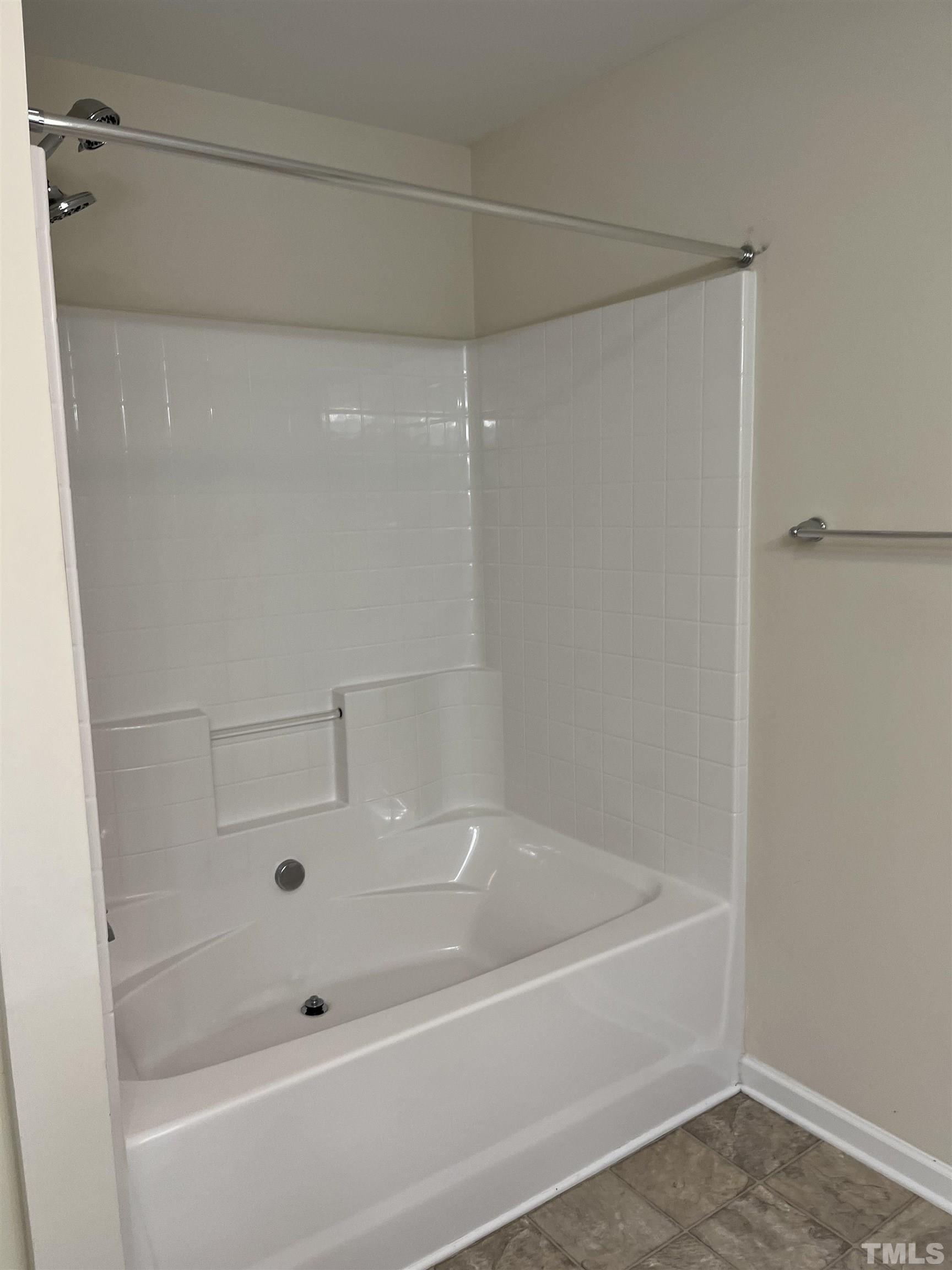 2499 Longshadow Drive Graham, NC 27253 - Photo 9 of 14 a bathroom with a bathtub