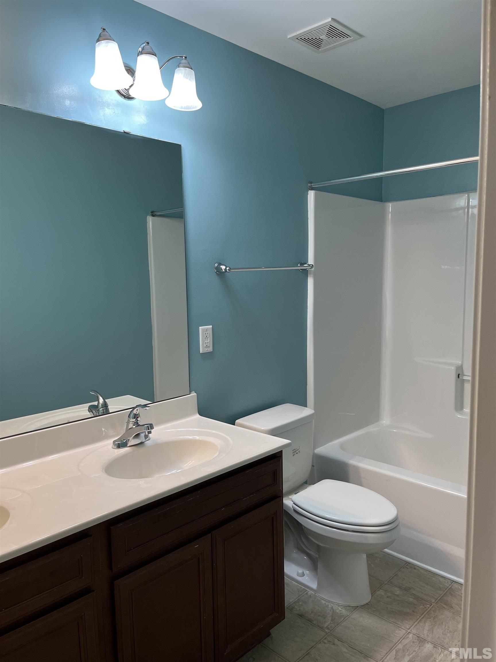 2499 Longshadow Drive Graham, NC 27253 - Photo 10 of 14 a bathroom with a sink a toilet and shower