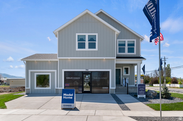 2819 South 710th West, Unit 14 Logan, UT 84321 - Photo 2 of 24 Contemporary two-story residence featuring light gray vertical siding and white trim