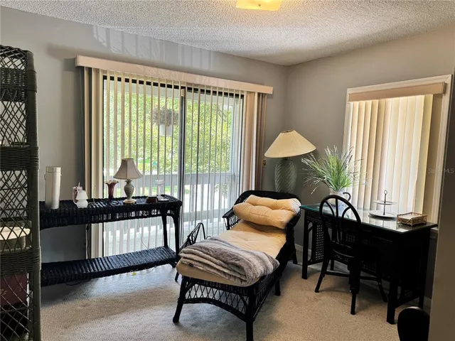 a bathroom with a bathtub and next to a window