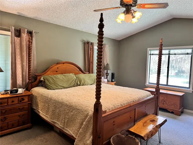 a bathroom with a sink a mirror and a shower