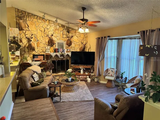 a living room with furniture and a fireplace