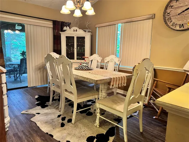 a view of a dining room with furniture and window
