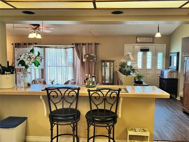 a kitchen with stainless steel appliances a stove a sink dishwasher and a microwave oven with cabinets