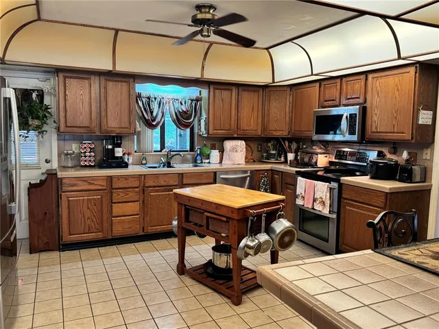 a living room with furniture and a lamp
