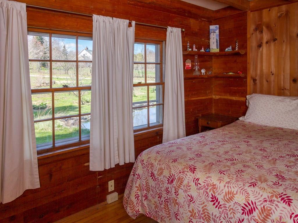 668 Morgan Bay Road Surry, ME 04684 - Photo 17 of 31 A first floor Bedroom in the...
