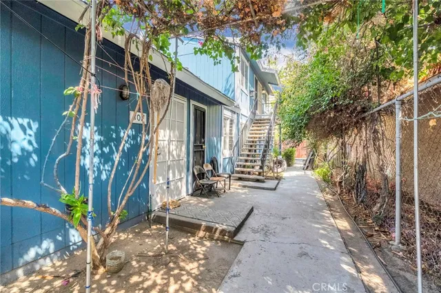 a backyard of a house with outdoor seating