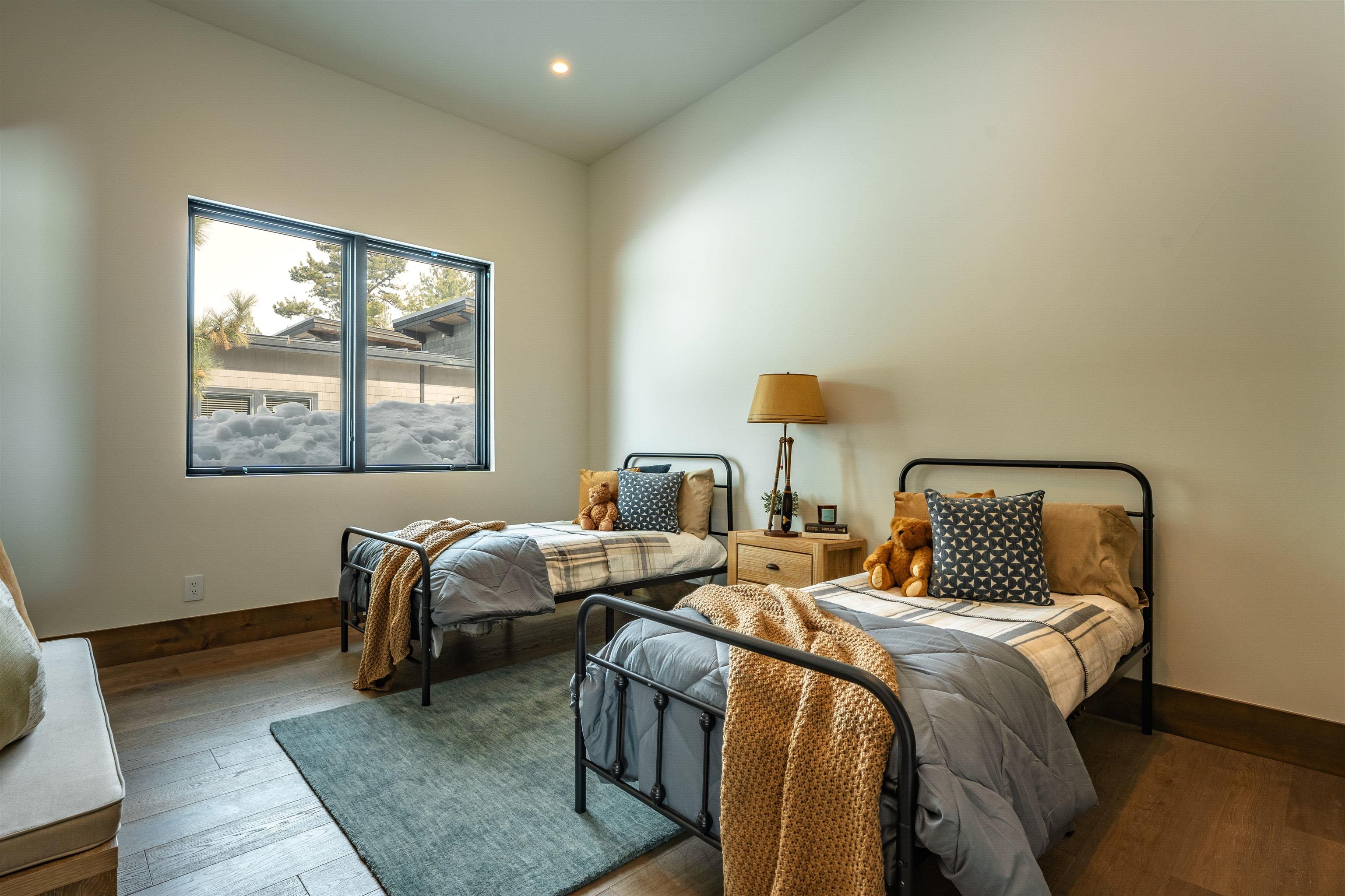 11646 Henness Road Truckee, CA 96161 - Photo 24 of 28 a bedroom with bed and a window