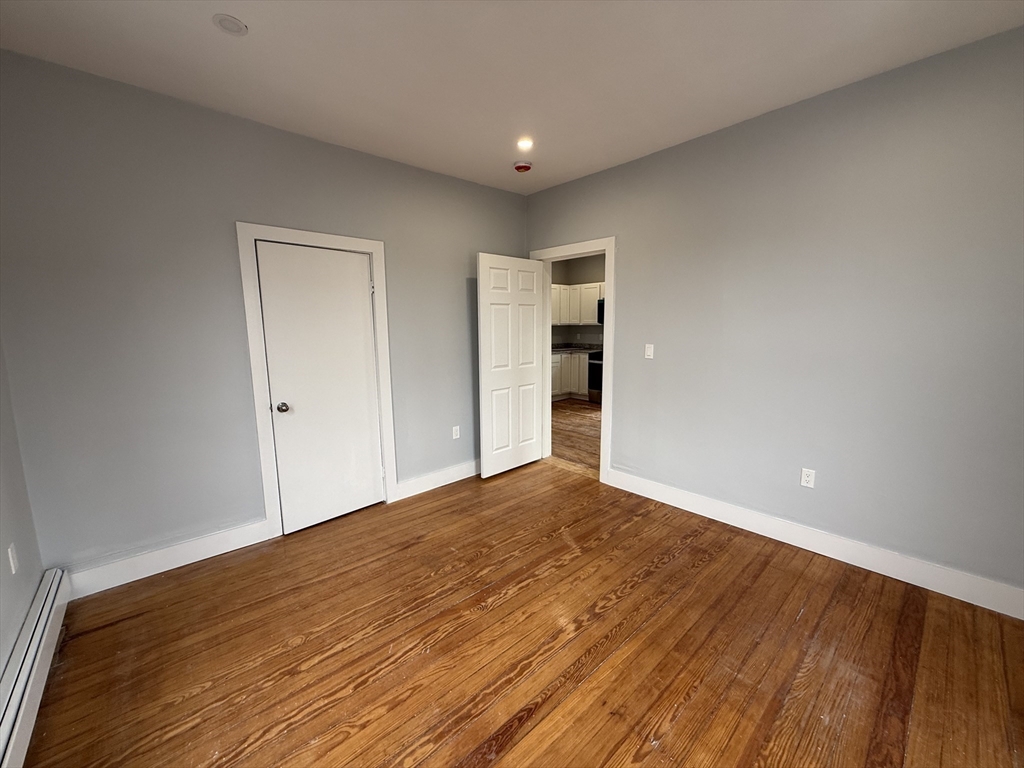 8 Carnes Street, Unit 2R Lynn, MA 01905 - Photo 11 of 15 a view of empty room with wooden floor