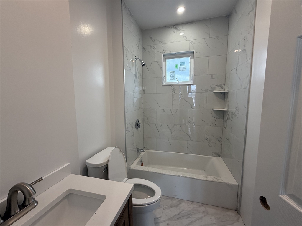 8 Carnes Street, Unit 2R Lynn, MA 01905 - Photo 13 of 15 a bathroom with a sink toilet and shower
