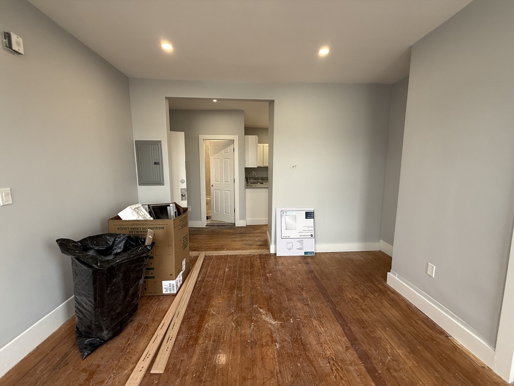 8 Carnes Street, Unit 2R Lynn, MA 01905 - Photo 6 of 15 a bedroom with a bed and a dresser