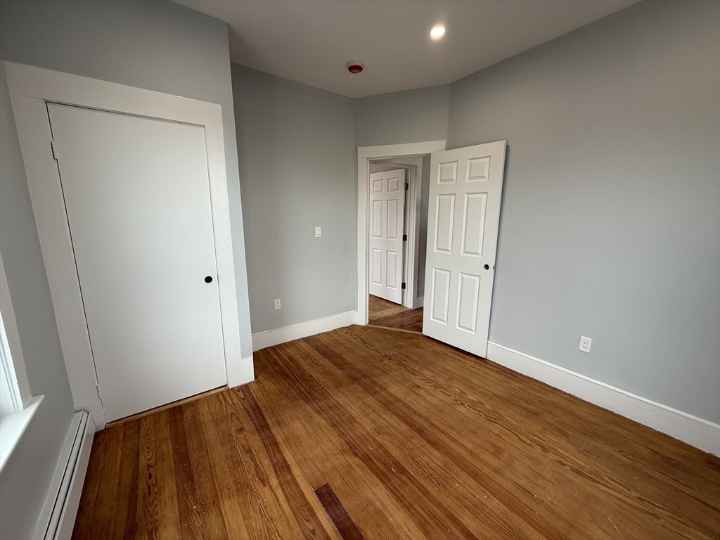 8 Carnes Street, Unit 2R Lynn, MA 01905 - Photo 9 of 15 a view of empty room with wooden floor