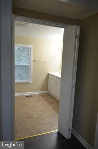 a view of an entryway with a mirror