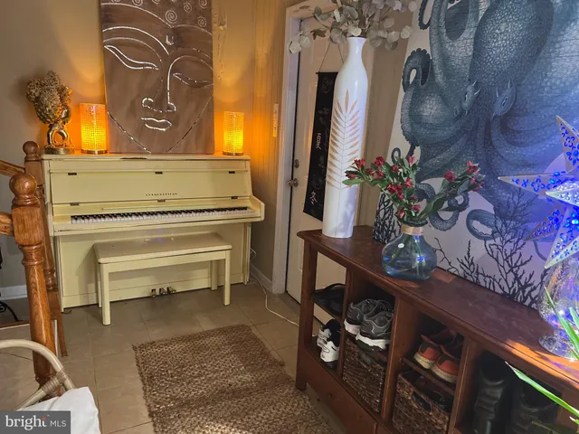 a living room with couch and a flat screen tv