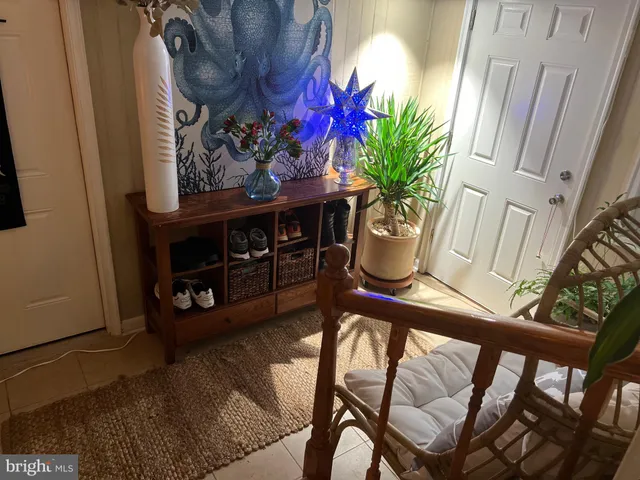 a living room with a wooden floor and a table