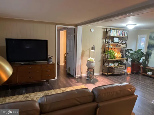 a house view with a sitting space and garden