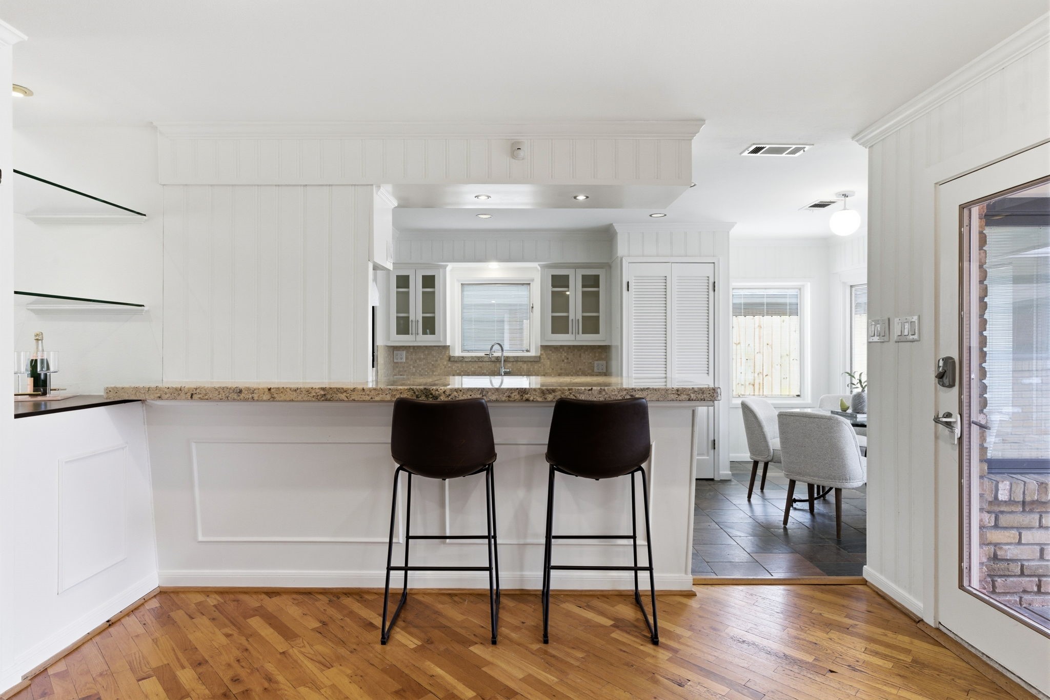 531 Azaleadell Drive Houston, TX 77018 - Photo 16 of 37 The open sightlines from kitchen to living showcase the home’s easy flow and functional layout. Fresh paint, updated cabinetry, and consistent finishes tie each space together for a polished, thoughtfully refreshed interior.
