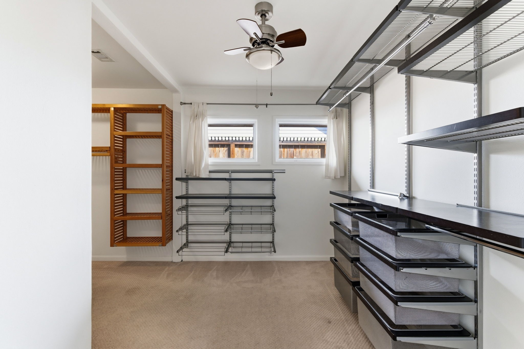 531 Azaleadell Drive Houston, TX 77018 - Photo 22 of 37 The oversized primary closet offers impressive built-in organization, including shelving and drawer systems designed for both function and visibility. Fresh paint continues here as well, creating a clean and well-maintained presentation from floor to ceiling.
