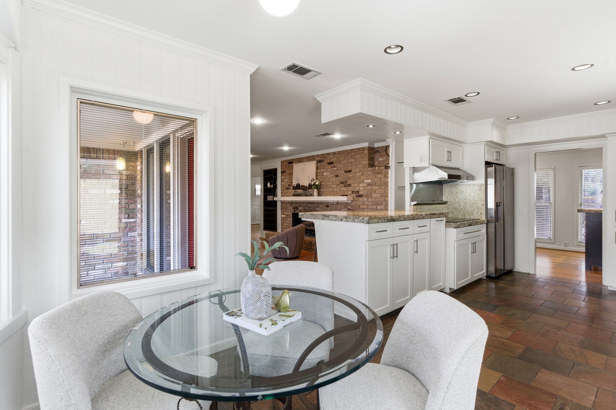 531 Azaleadell Drive Houston, TX 77018 - Photo 8 of 37 The breakfast area is filled with natural light from surrounding windows, creating a cheerful space to start the day. Crisp painted millwork and clean lines continue the cohesive interior updates seen throughout the home.