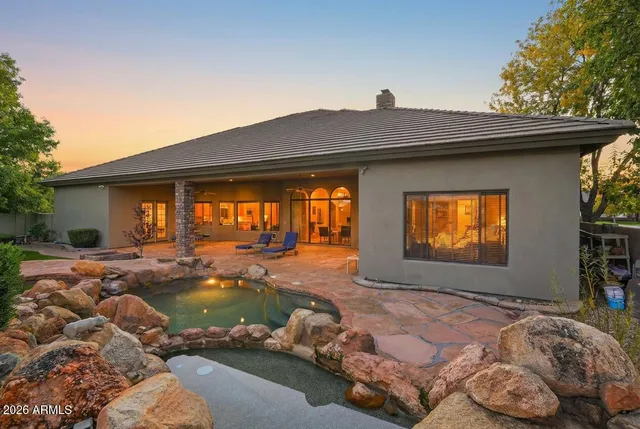 a front view of house with yard outdoor seating and barbeque oven