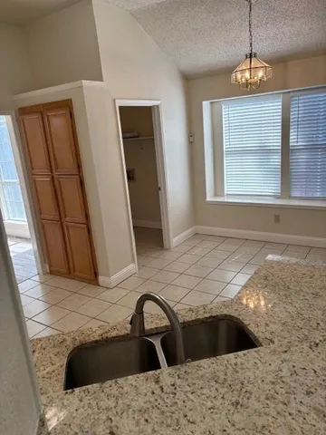 a kitchen with a sink and a window