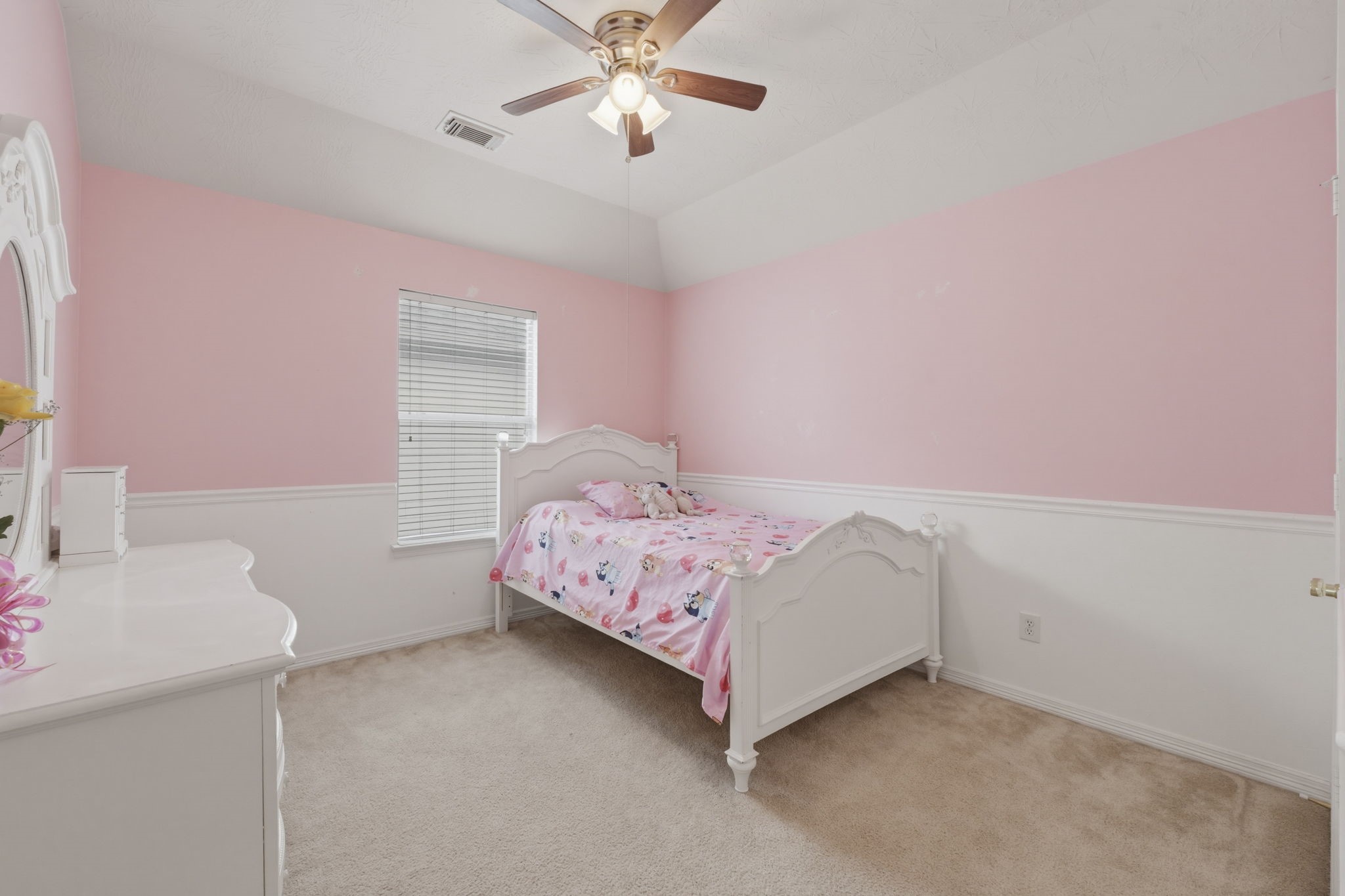 3006 Country Boy Court Spring, TX 77373 - Photo 12 of 17 a bedroom with a bed and a chandelier