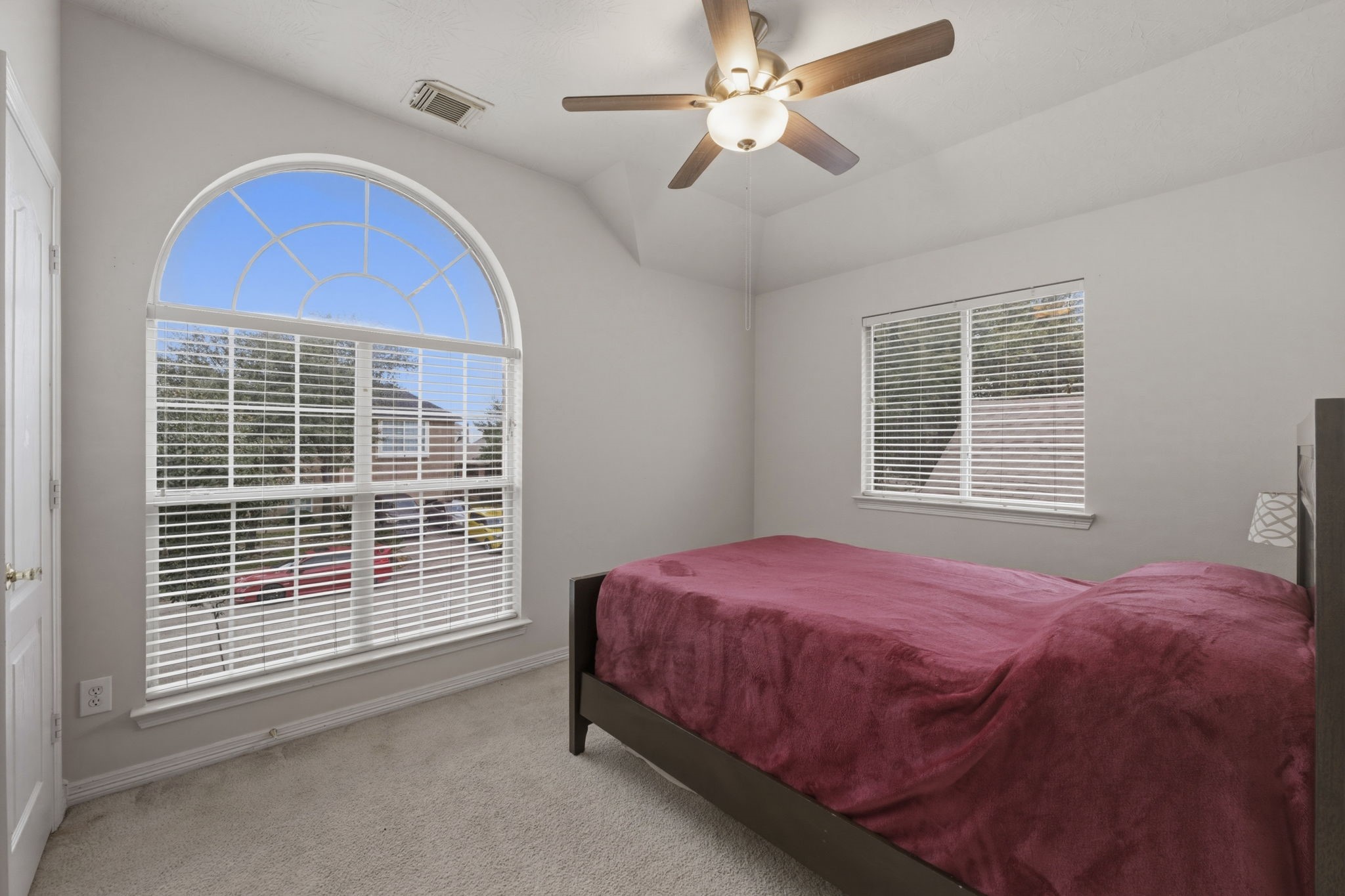 3006 Country Boy Court Spring, TX 77373 - Photo 14 of 17 a bedroom with a bed and a ceiling fan