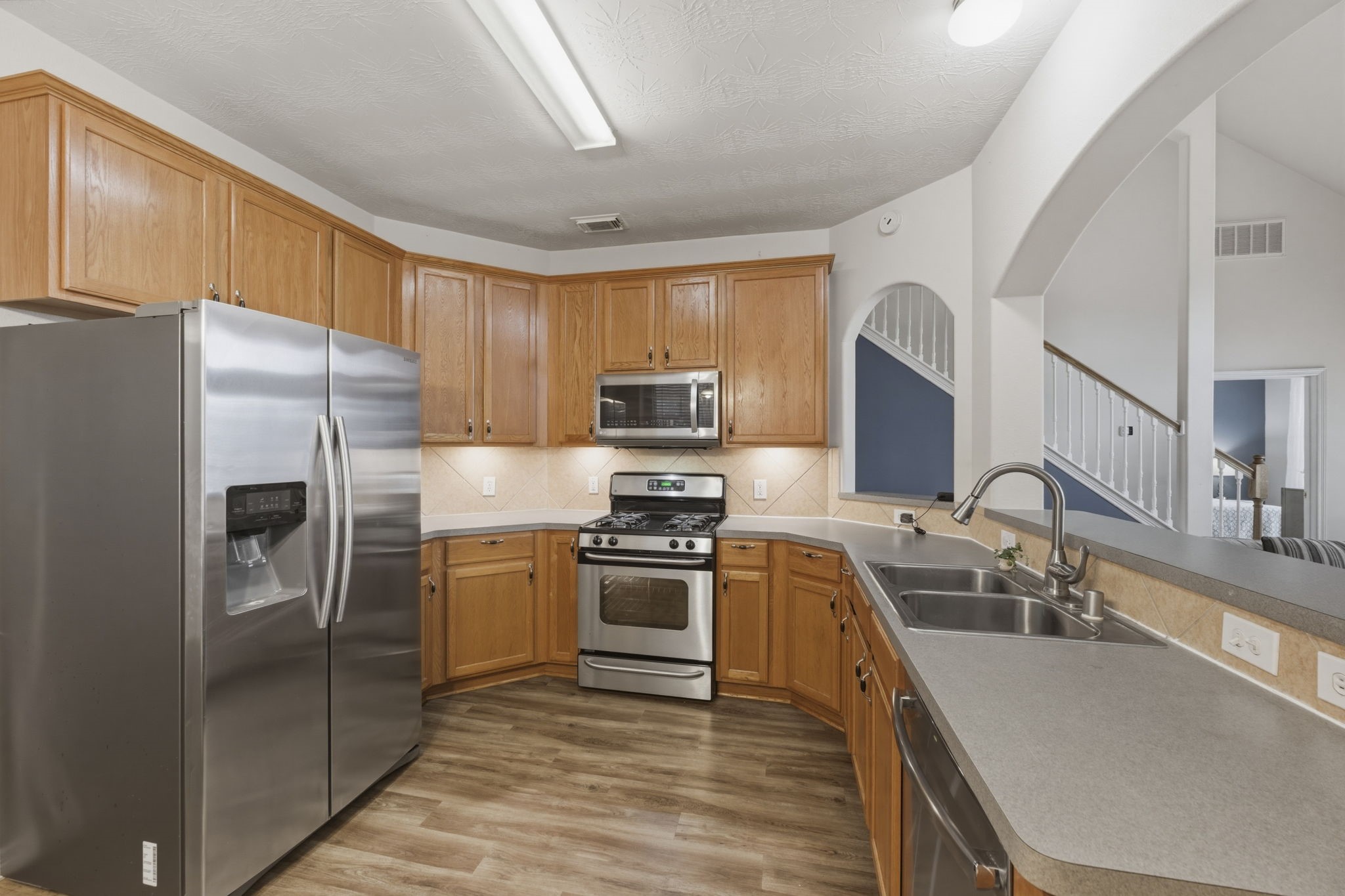 3006 Country Boy Court Spring, TX 77373 - Photo 4 of 17 a kitchen with a sink stove and refrigerator