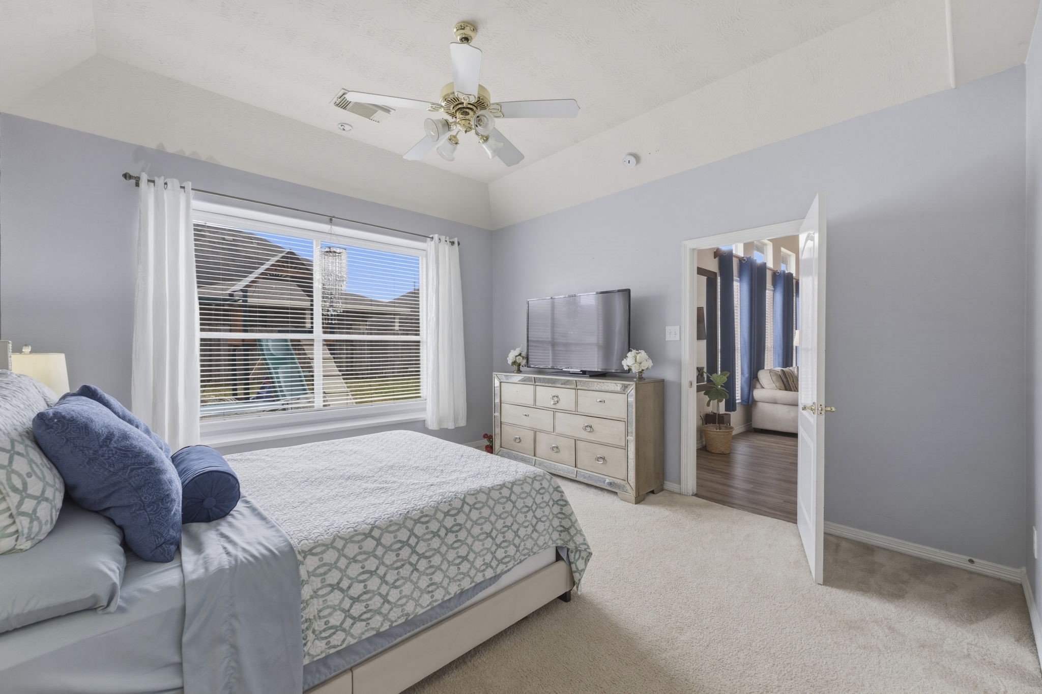 3006 Country Boy Court Spring, TX 77373 - Photo 7 of 17 a bedroom with a bed furniture and a window
