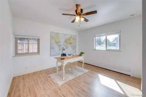 a work room with wooden floor and a window