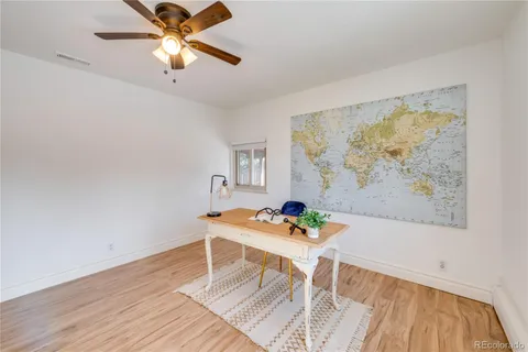 a dining room with wooden floor and a dining table