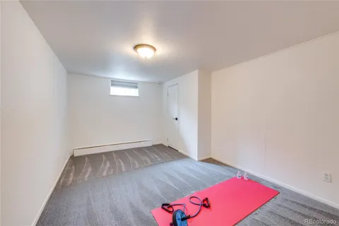 an empty room with wooden floor and closet
