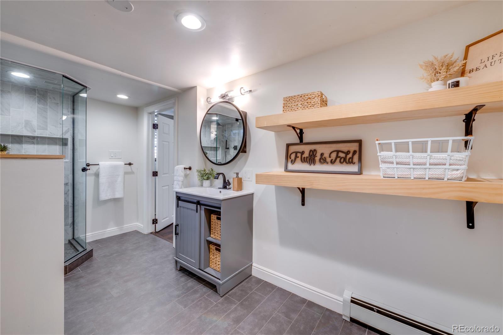 6811 West 48th Avenue Wheat Ridge, CO 80033 - Photo 20 of 33 a view of a hallway with washer and dryer