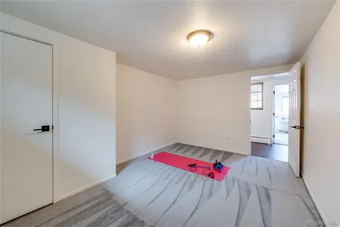 a room with a bed and furniture