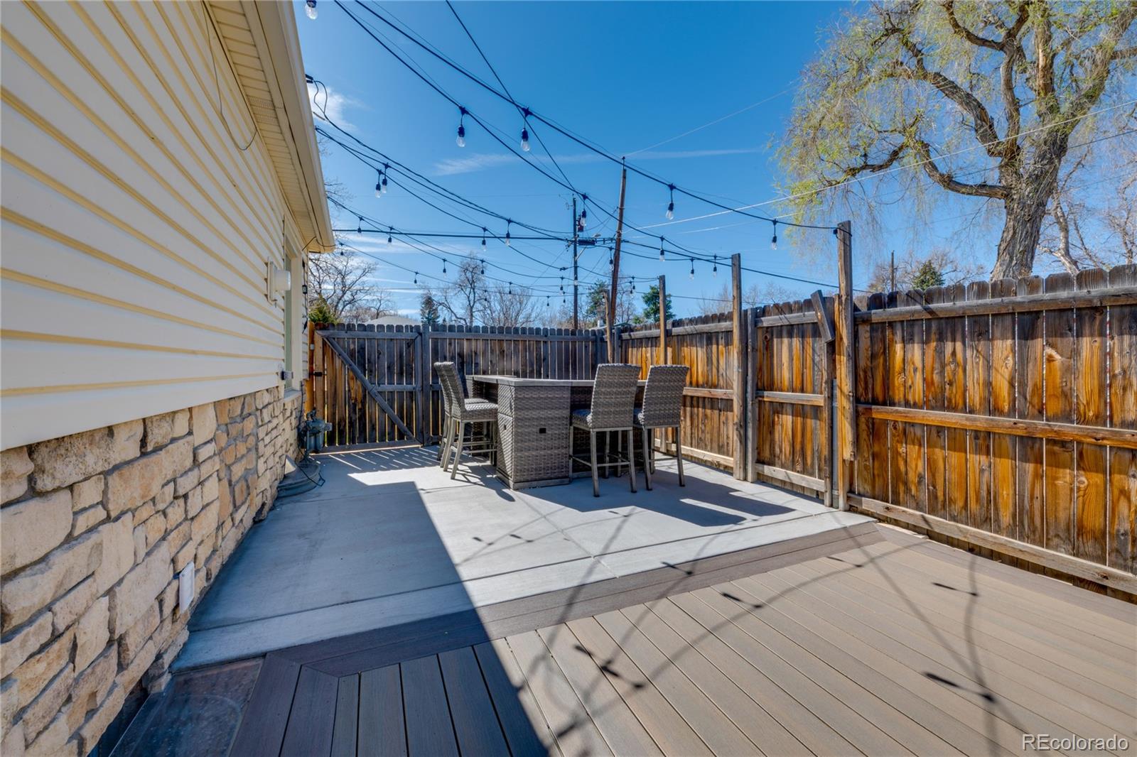 6811 West 48th Avenue Wheat Ridge, CO 80033 - Photo 23 of 33 a view of a patio with wooden floor