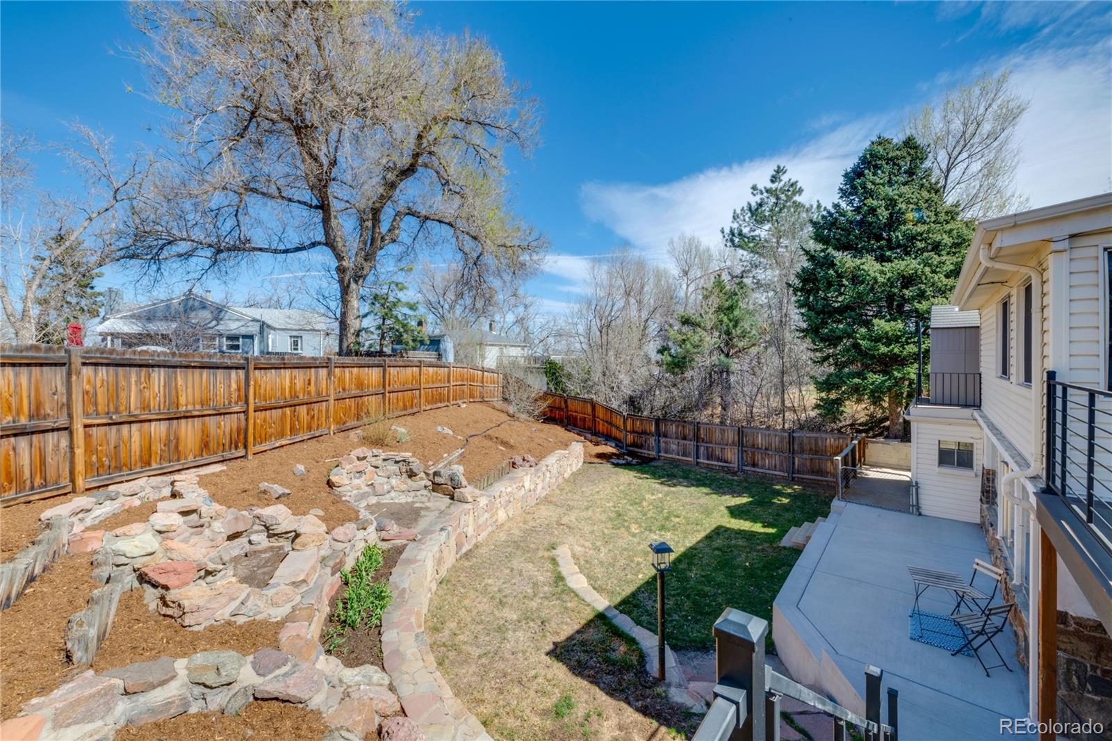 6811 West 48th Avenue Wheat Ridge, CO 80033 - Photo 24 of 33 a view of backyard with patio