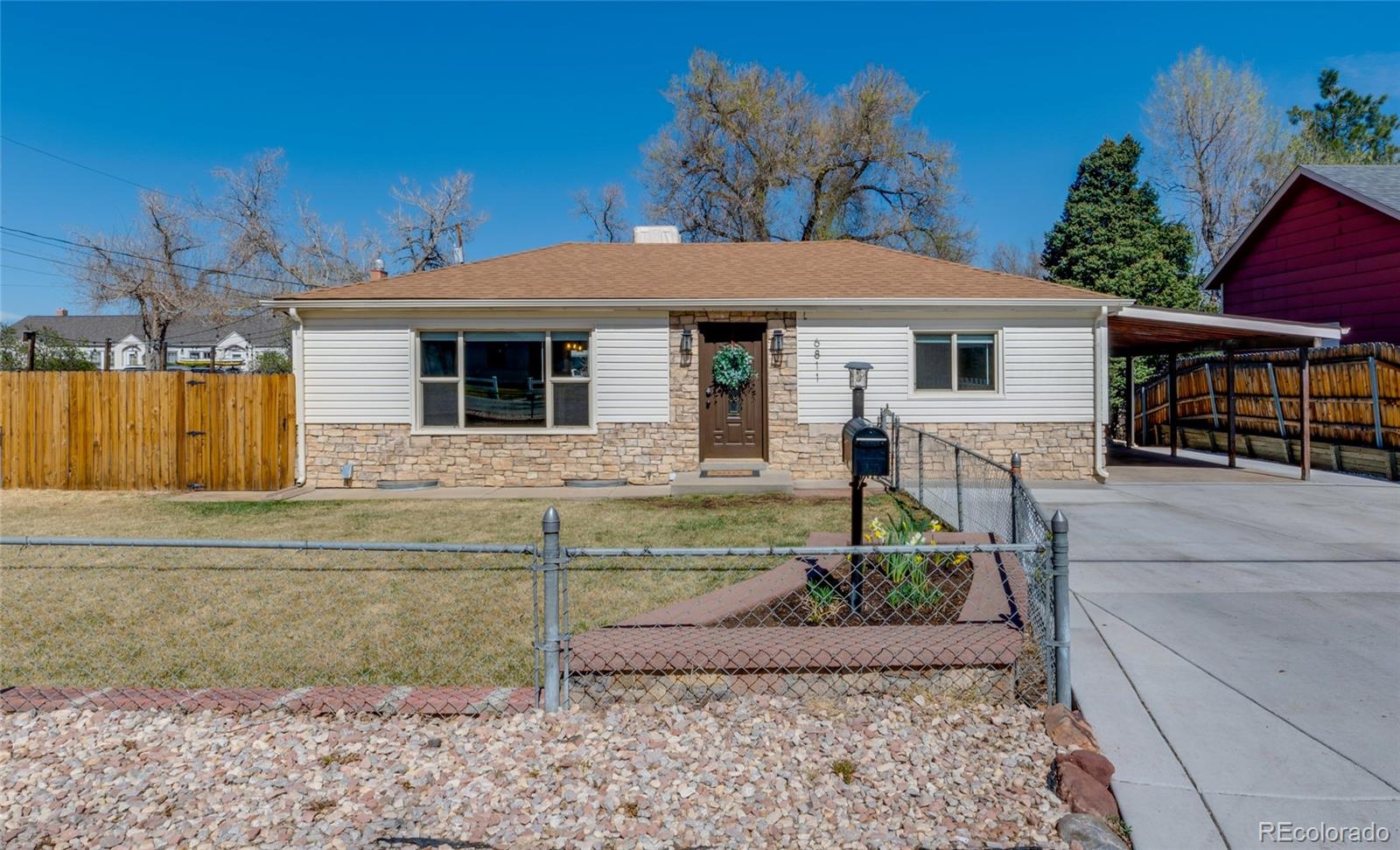 6811 West 48th Avenue Wheat Ridge, CO 80033 - Photo 30 of 33 a view of a house with backyard
