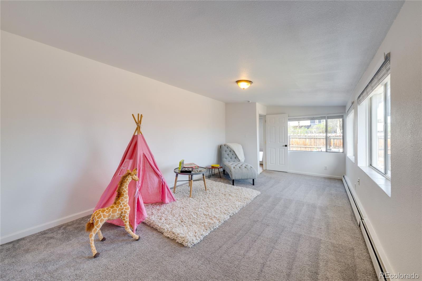 6811 West 48th Avenue Wheat Ridge, CO 80033 - Photo 7 of 33 a living room with furniture and a wooden floor