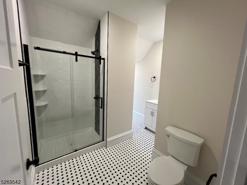 314 Cornelia Street, Unit 4 Boonton, NJ 07005 - Photo 25 of 32 a bathroom with a toilet and a shower