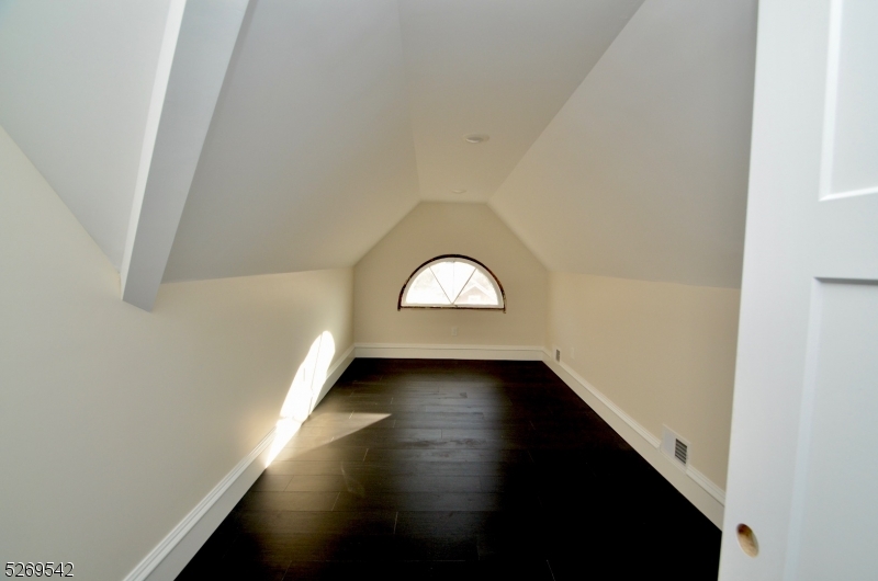 314 Cornelia Street, Unit 4 Boonton, NJ 07005 - Photo 29 of 32 an empty room with wooden floor and windows