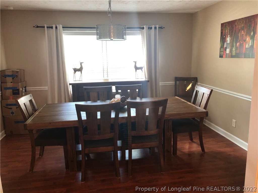 310 Old Farm Road Raeford, NC 28376 - Photo 13 of 29 a view of a dining room with furniture window and wooden floor