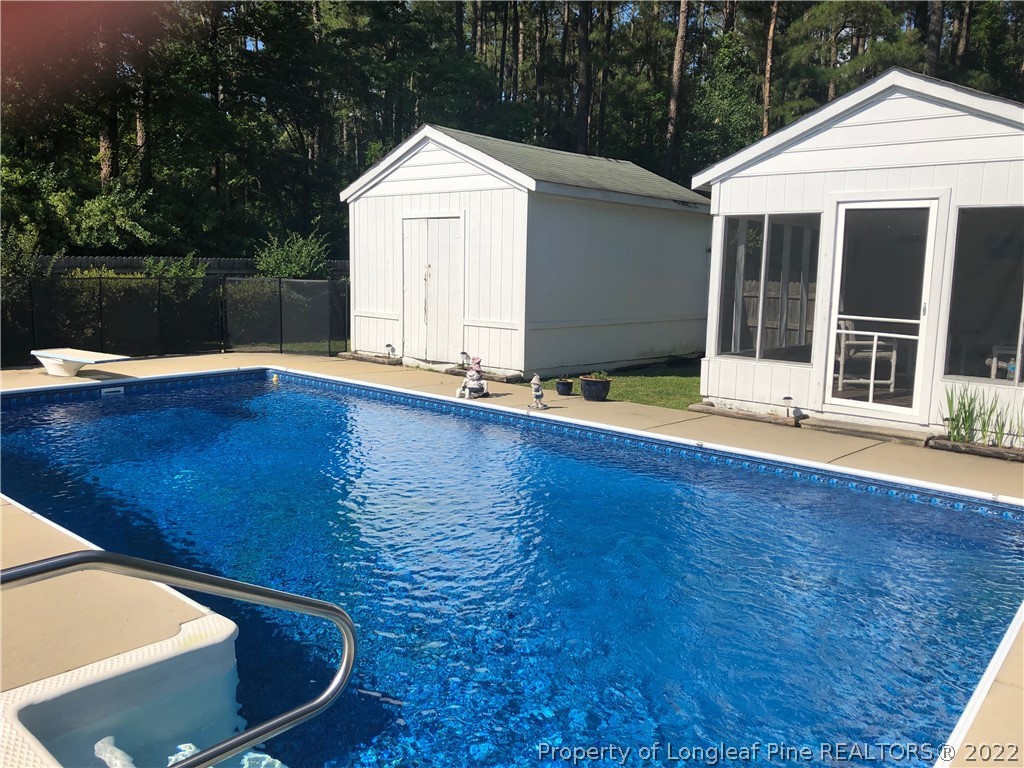 310 Old Farm Road Raeford, NC 28376 - Photo 3 of 29 a view of a house with pool