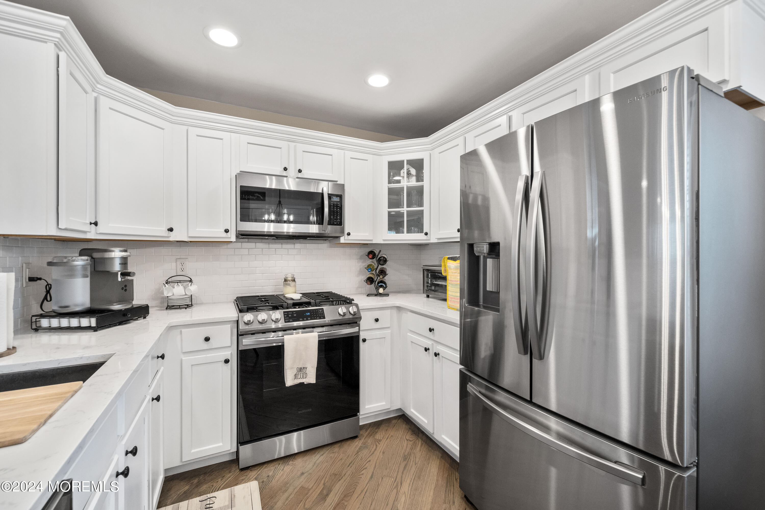 5 Kuczynski Drive, Unit 945 Parlin, NJ 08859 - Photo 13 of 62 a kitchen with stainless steel appliances granite countertop a refrigerator stove and sink